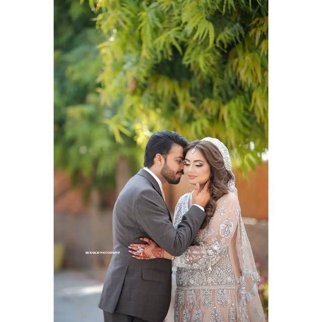 Couple celebrating at an evening wedding reception