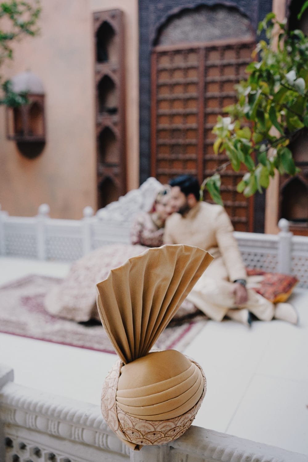 Bride and groom together in a warmly lit wedding courtyard