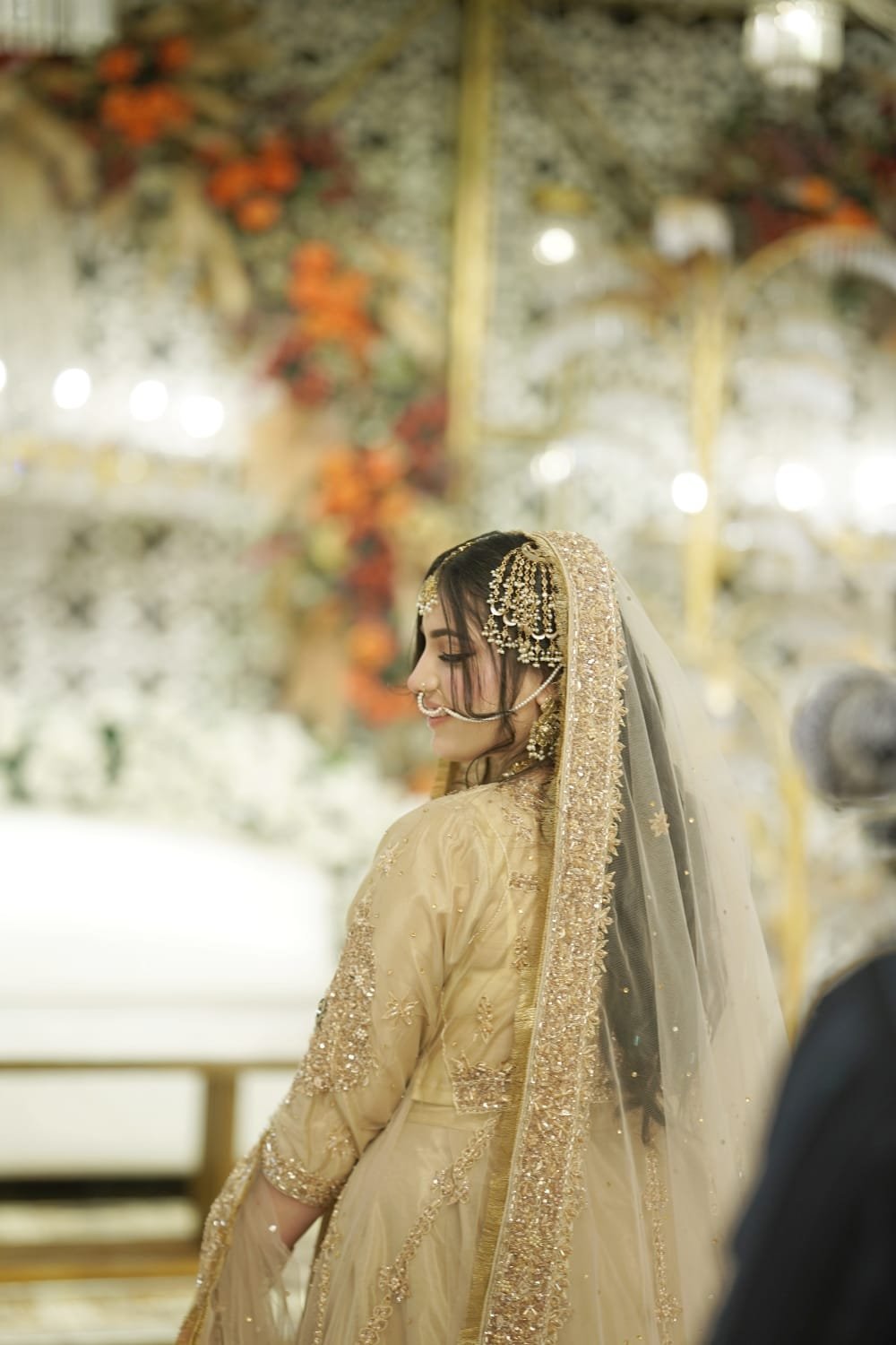 Close-up of bridal henna, rings and floral jewellery