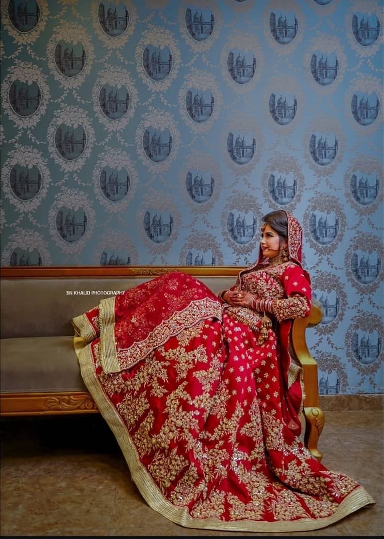 Close-up of bridal henna, rings and floral jewellery