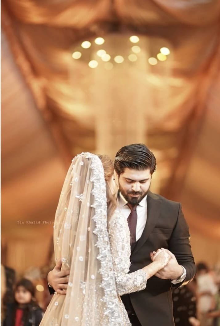 Bride and groom photographed during their wedding celebration