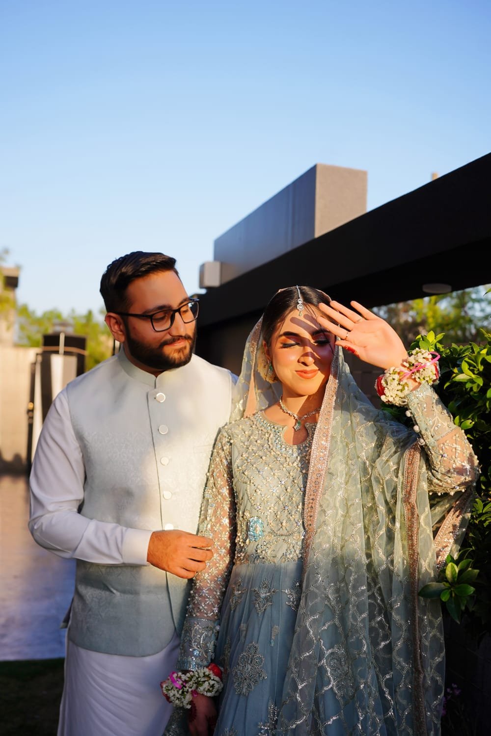 Bride and groom together in a wedding courtyard